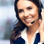 Call Center Service. Photo of customer support or sales agent. Female caller or receptionist phone operator. Copy space for some text, advertising or slogan. Help line answering and telemarketing.